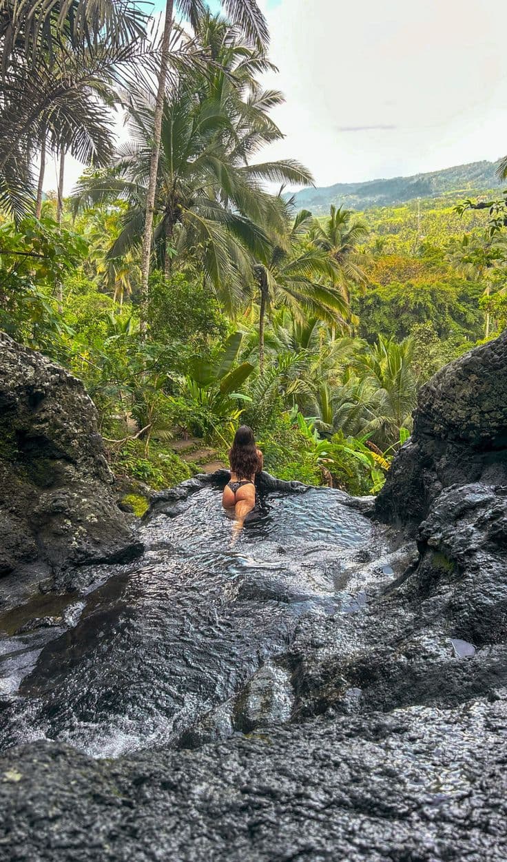 the hidden Gembleng Waterfall, famous for its natural infinity pools and stunning valley views—perfect for photos and relaxation