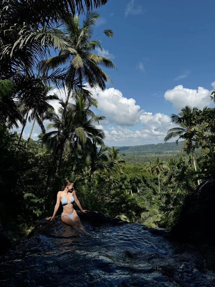 the hidden Gembleng Waterfall, famous for its natural infinity pools and stunning valley views—perfect for photos and relaxation