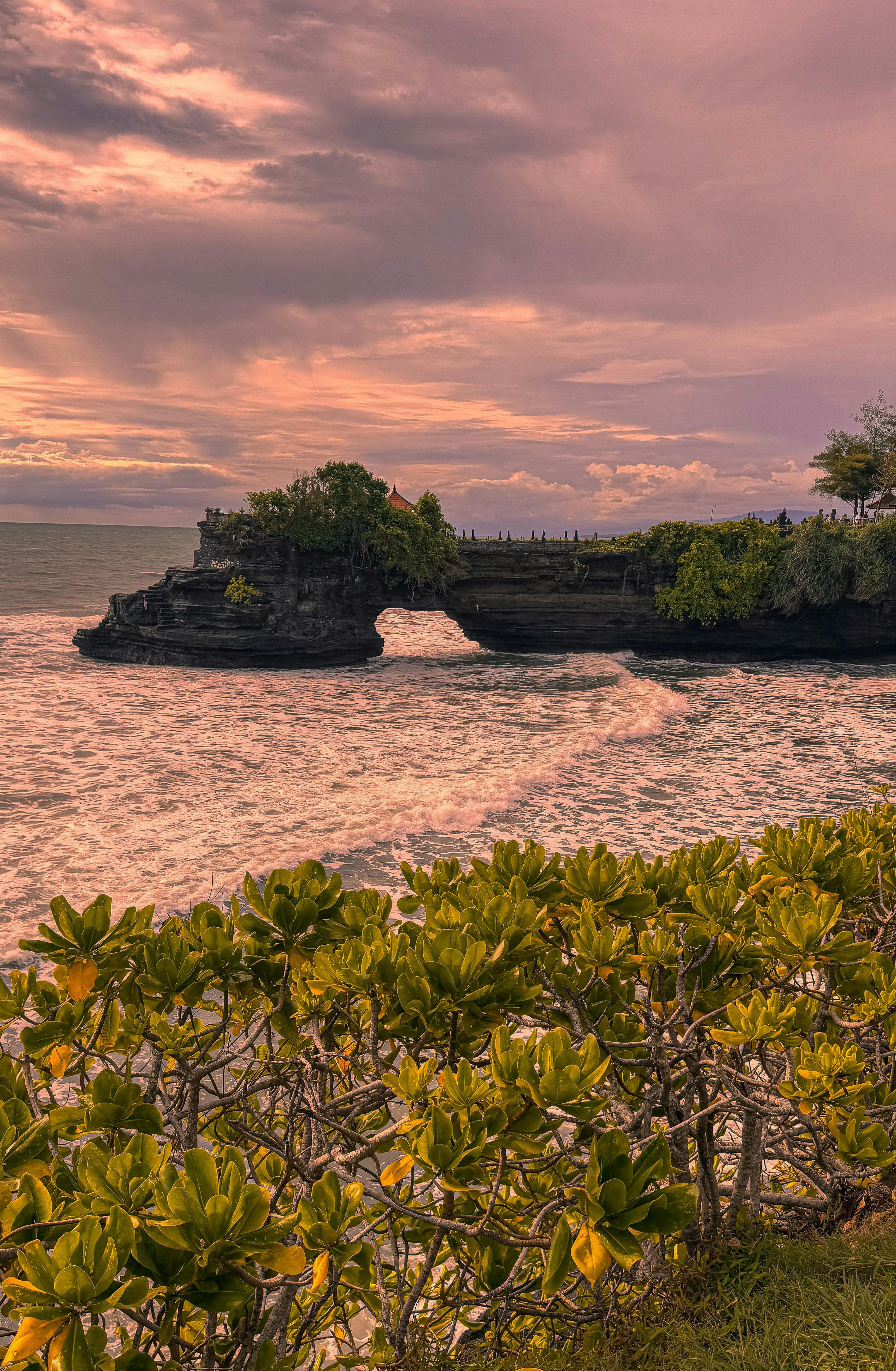 One of Bali’s most famous ocean temples, dramatically perched on a rock formation surrounded by the sea.