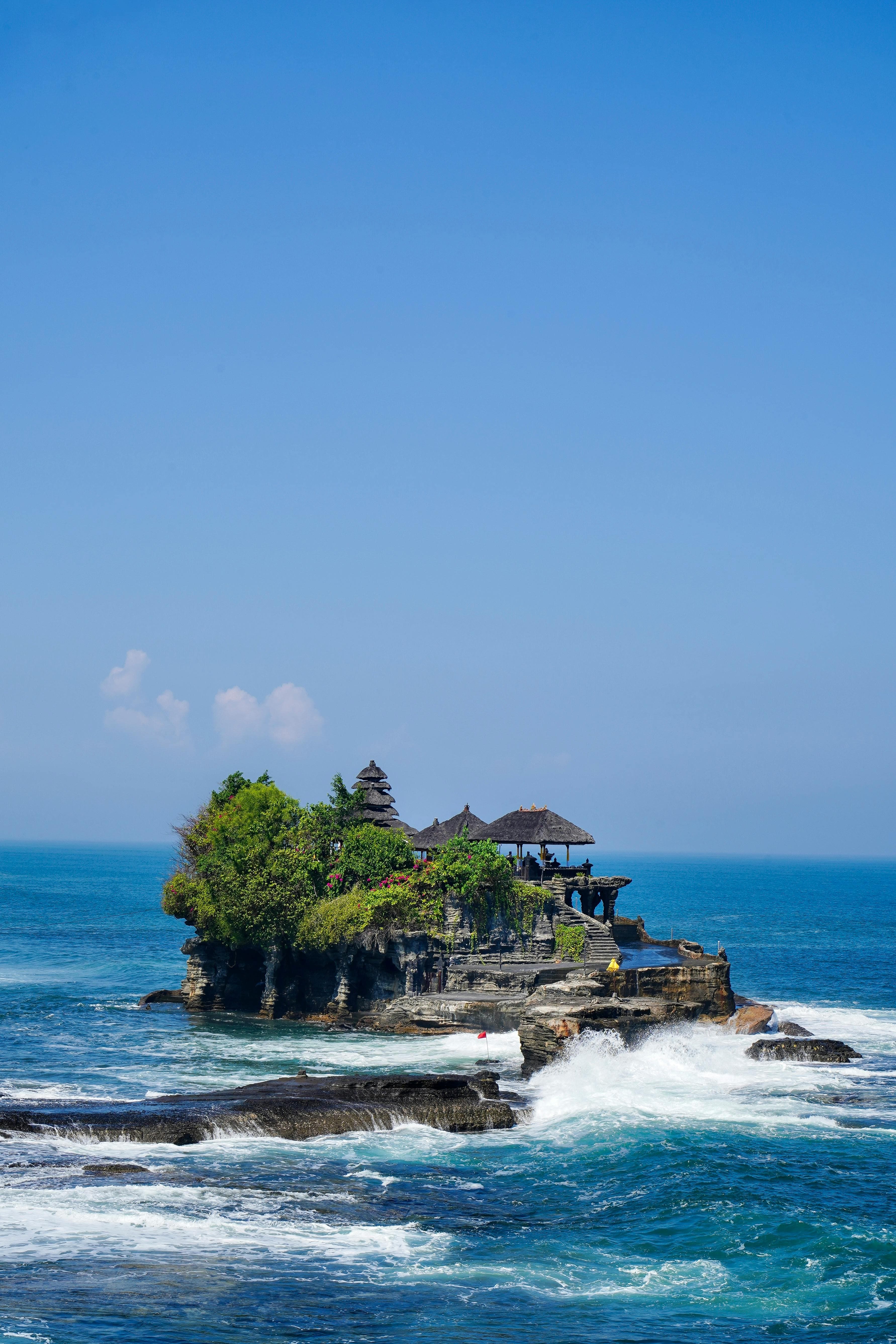 One of Bali’s most famous ocean temples, dramatically perched on a rock formation surrounded by the sea.
