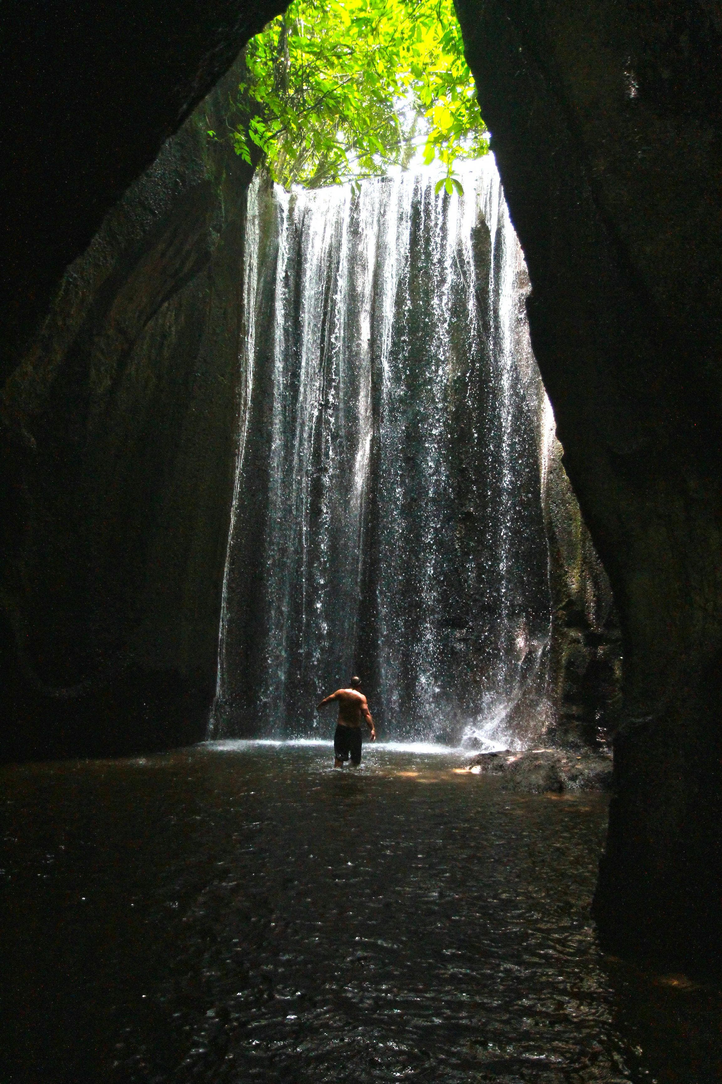 Explore one of Bali’s most unique hidden waterfalls, famous for its magical sunlight rays shining through the cave.