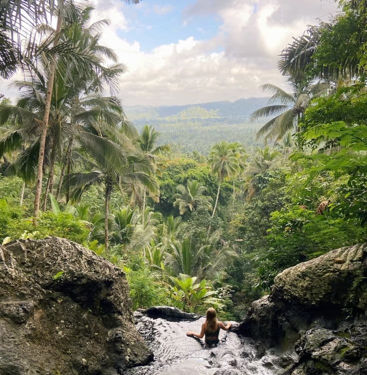 the hidden Gembleng Waterfall, famous for its natural infinity pools and stunning valley views—perfect for photos and relaxation