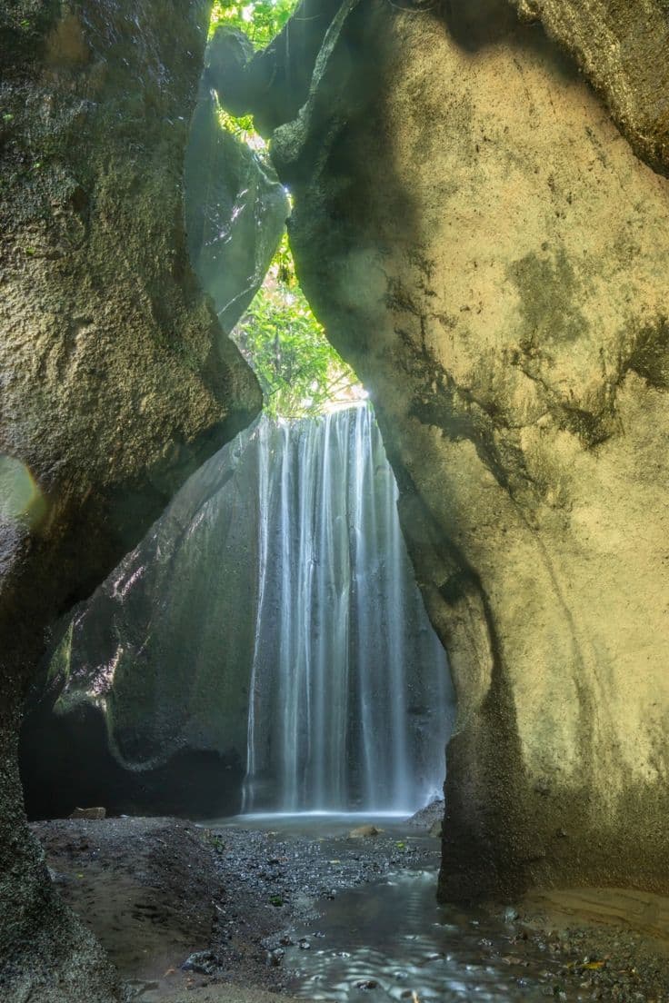 Tukad Cepung Waterfall is a very beautiful waterfall tourist attraction, where the uniqueness of this waterfall is when the water that falls from above and is exposed to the sun will look like twinkling