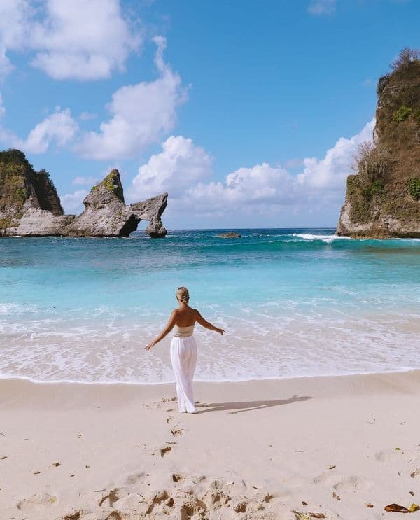 Atuh Beach Nusa Penida is a hidden gem surrounded by dramatic cliffs and rock formations, featuring soft white sand and calm turquoise waters. Atuh Beach Nusa Penida is a hidden gem surrounded by dramatic cliffs and rock formations, featuring soft white sand and calm turquoise waters.